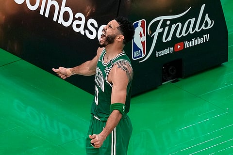 Jayson Tatum celebrates after scoring 